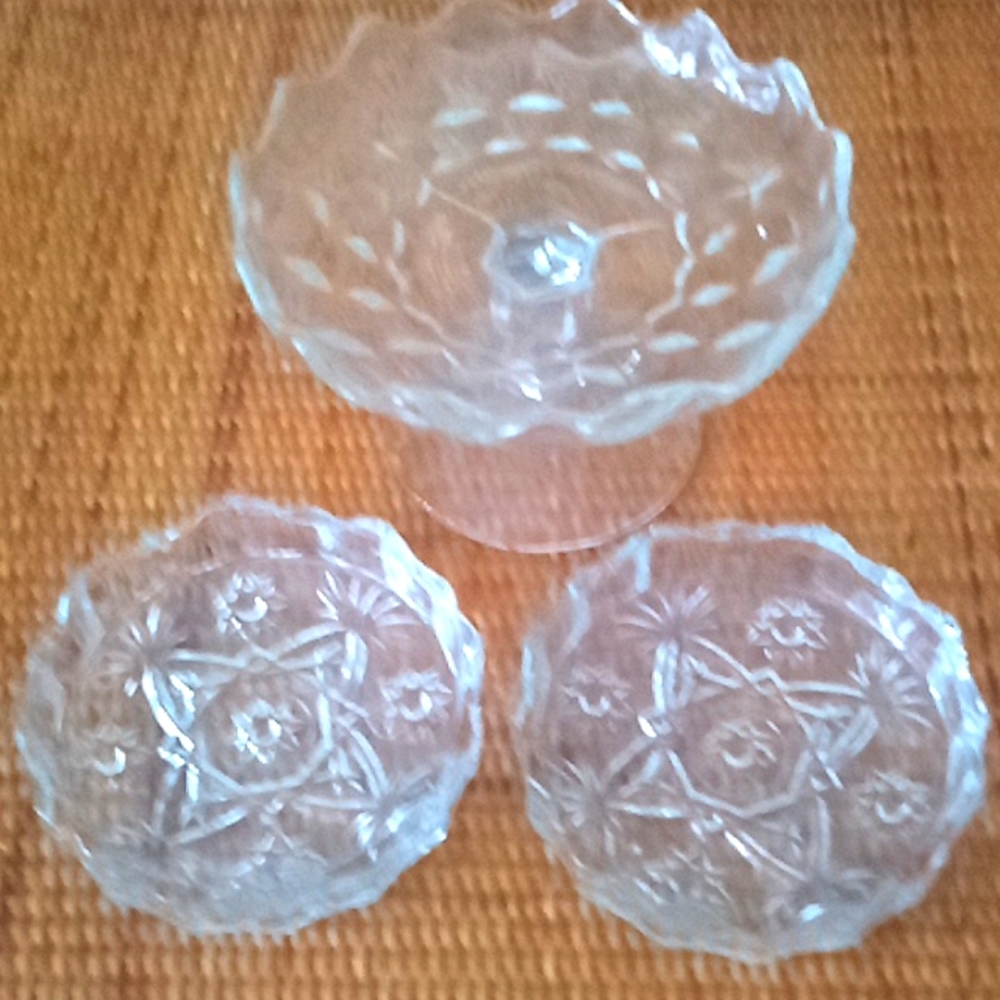 Lovely pressed glass Fostoria  compote and two pressed glass candle holders.